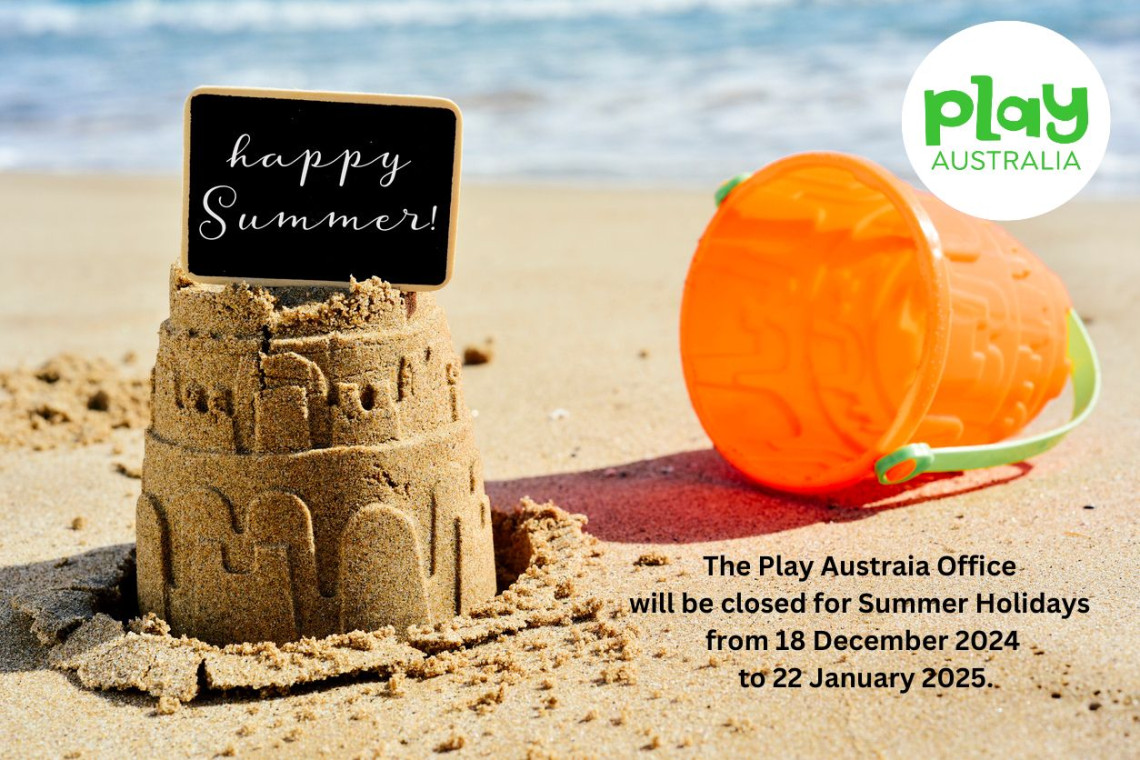 Sandcastles on the beach with the message "Happy Summer"
