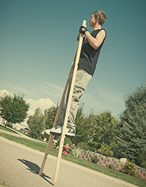 teen on stilts